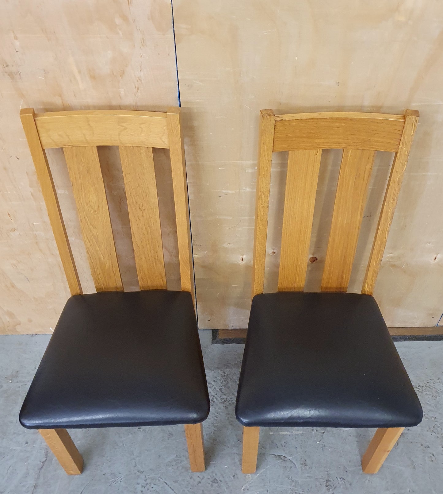 2 Matching Oak Dining Chairs with Dark Brown Faux Leather Seats - EL104354 / EL104355