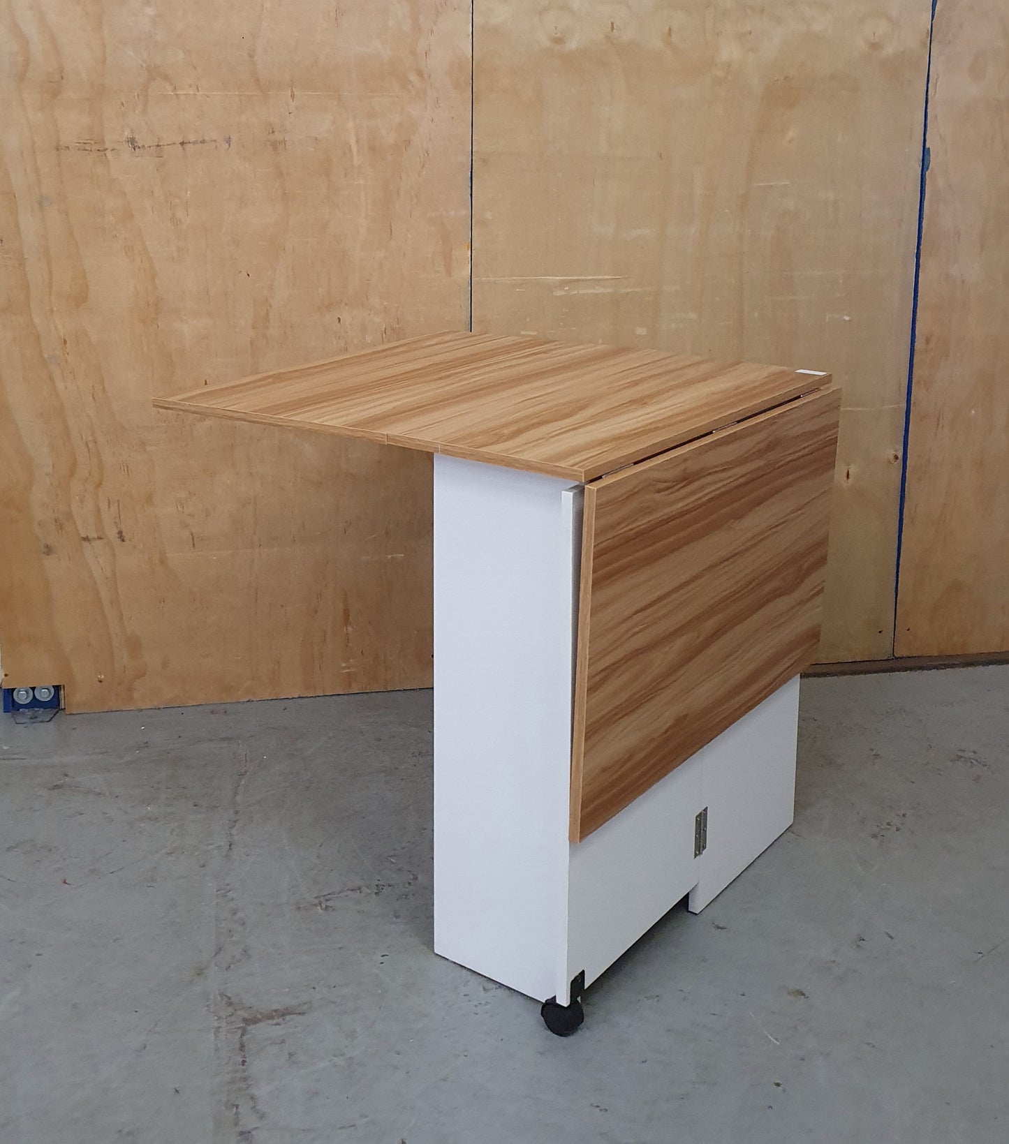 White Wood Drop Leaf Table with Lover Shelving and Castor Wheels - 103780
