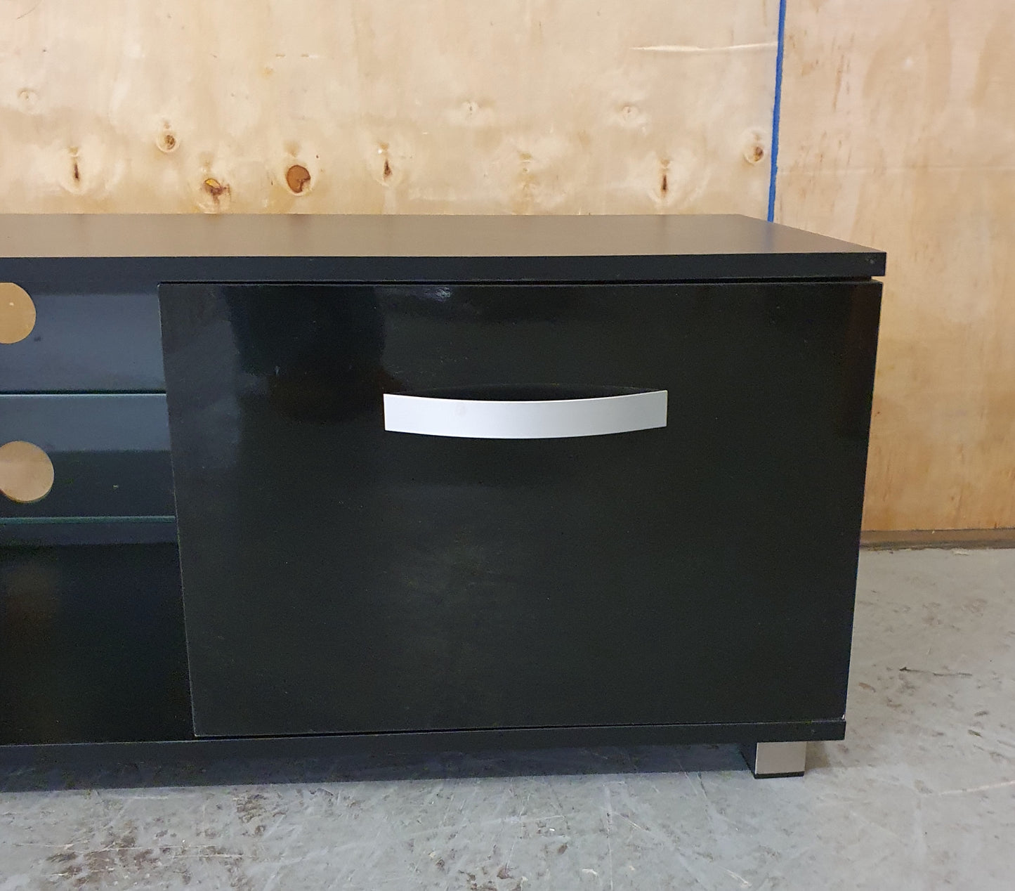 Black Gloss TV Stand with 2 Doors and Centre Glass Shelf - EL104258