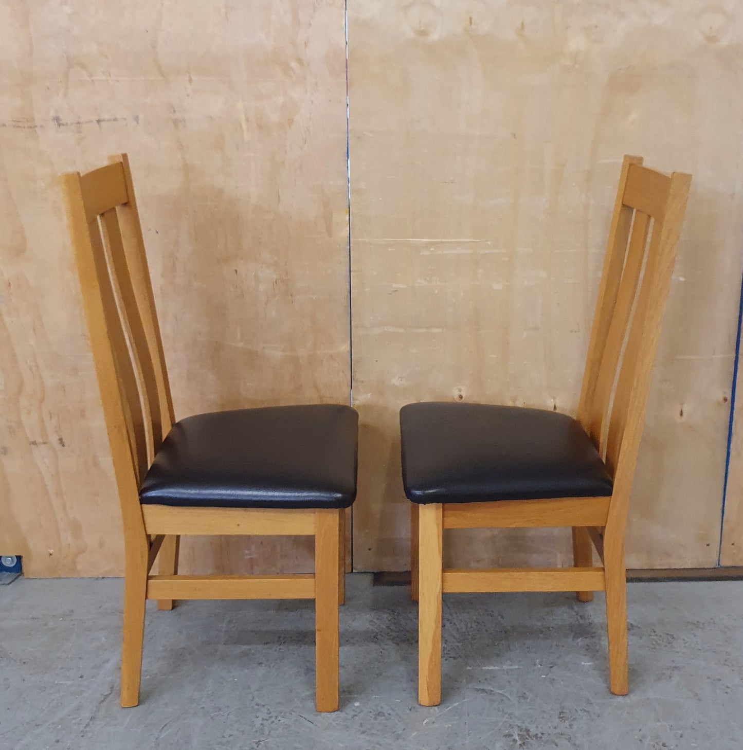 2 Matching Oak Dining Chairs with Dark Brown Faux Leather Seats - EL104354 / EL104355