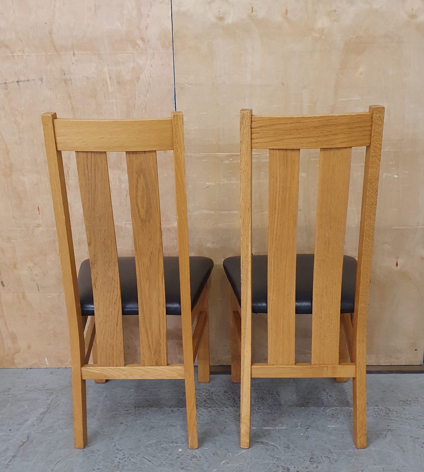 2 Matching Oak Dining Chairs with Dark Brown Faux Leather Seats - EL104354 / EL104355