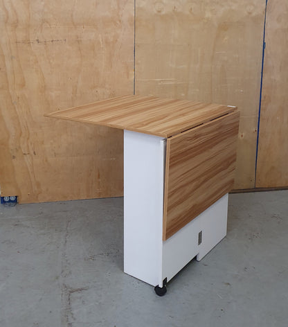 White Wood Drop Leaf Table with Lover Shelving and Castor Wheels - 103780