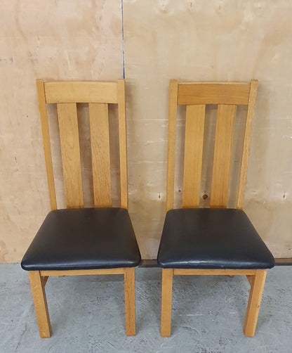 2 Matching Oak Dining Chairs with Dark Brown Faux Leather Seats - EL104354 / EL104355