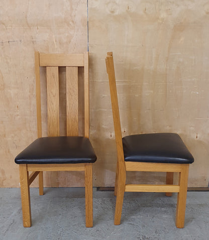 2 Matching Oak Dining Chairs with Dark Brown Faux Leather Seats - EL104354 / EL104355